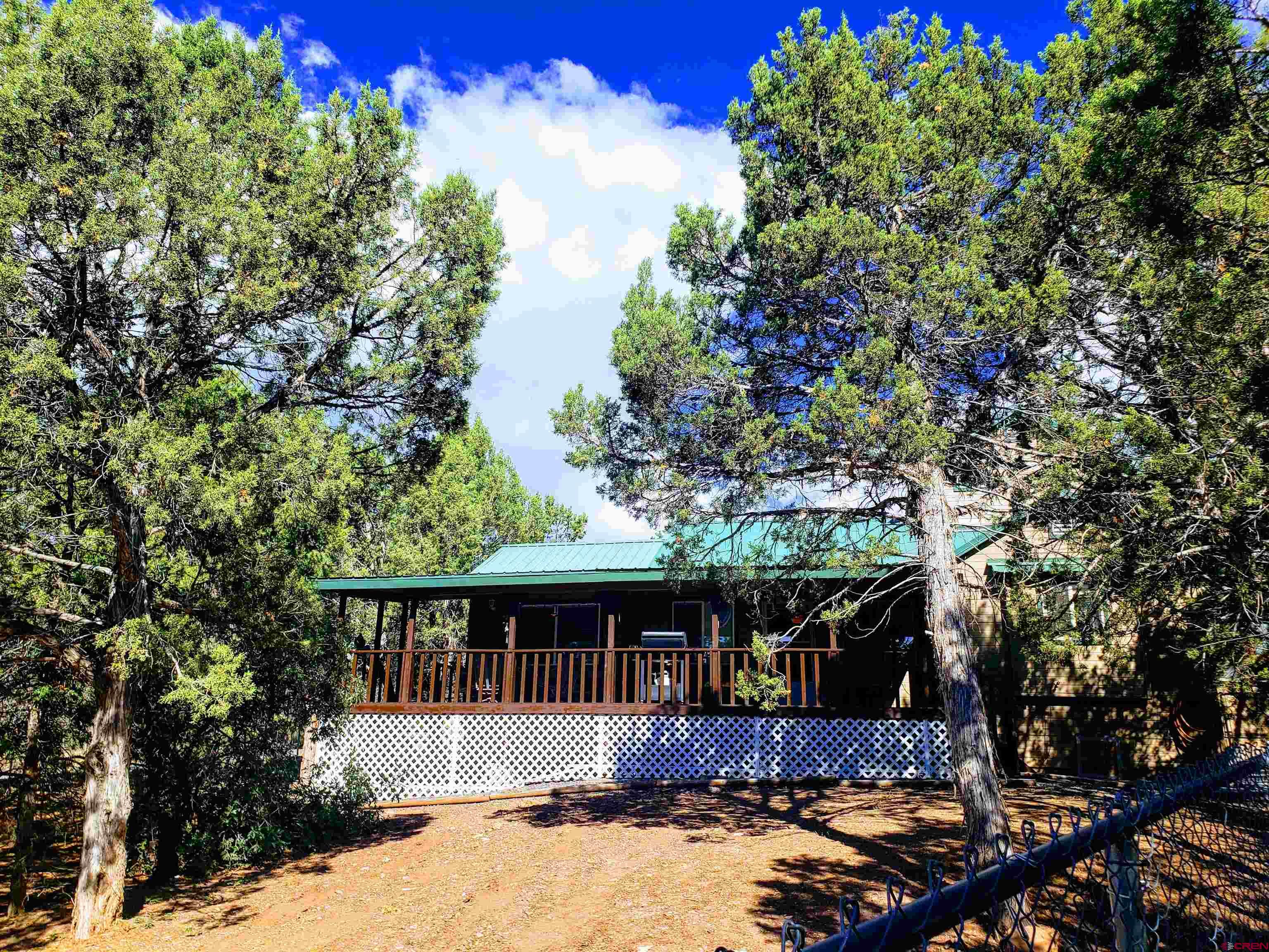 20915 Upland Road Cedaredge, CO 81413 - Photo 7 of 35 a front view of a house with a garden