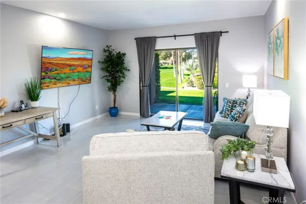 a living room with furniture and a large window