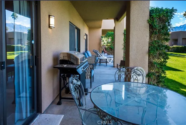 a view of a dining room with furniture window and outside view