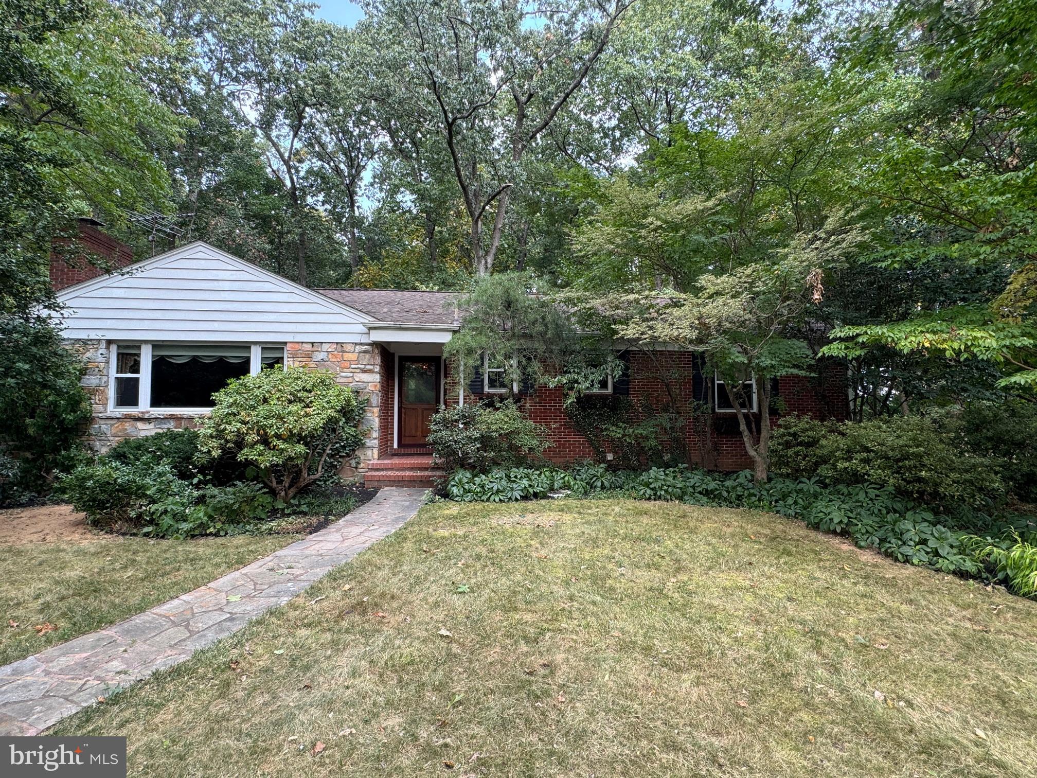 7201 Hawkins Creamery Road Gaithersburg, MD 20882 - Photo 1 of 19 a front view of a house with a yard and porch