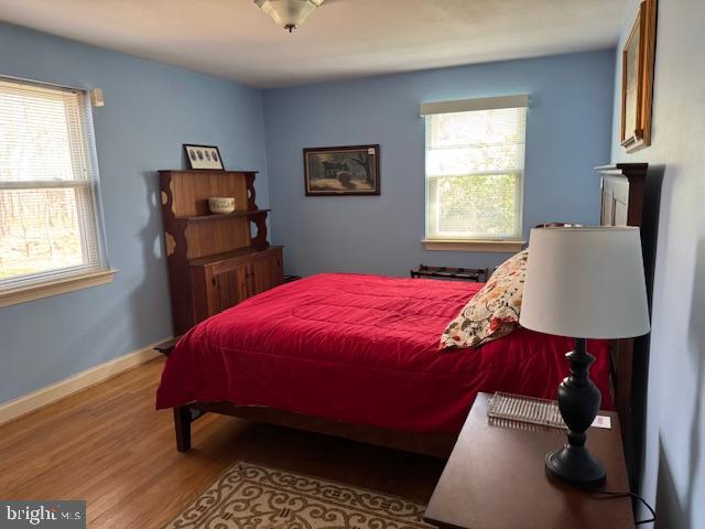7201 Hawkins Creamery Road Gaithersburg, MD 20882 - Photo 12 of 19 a bed sitting in a bedroom next to a window