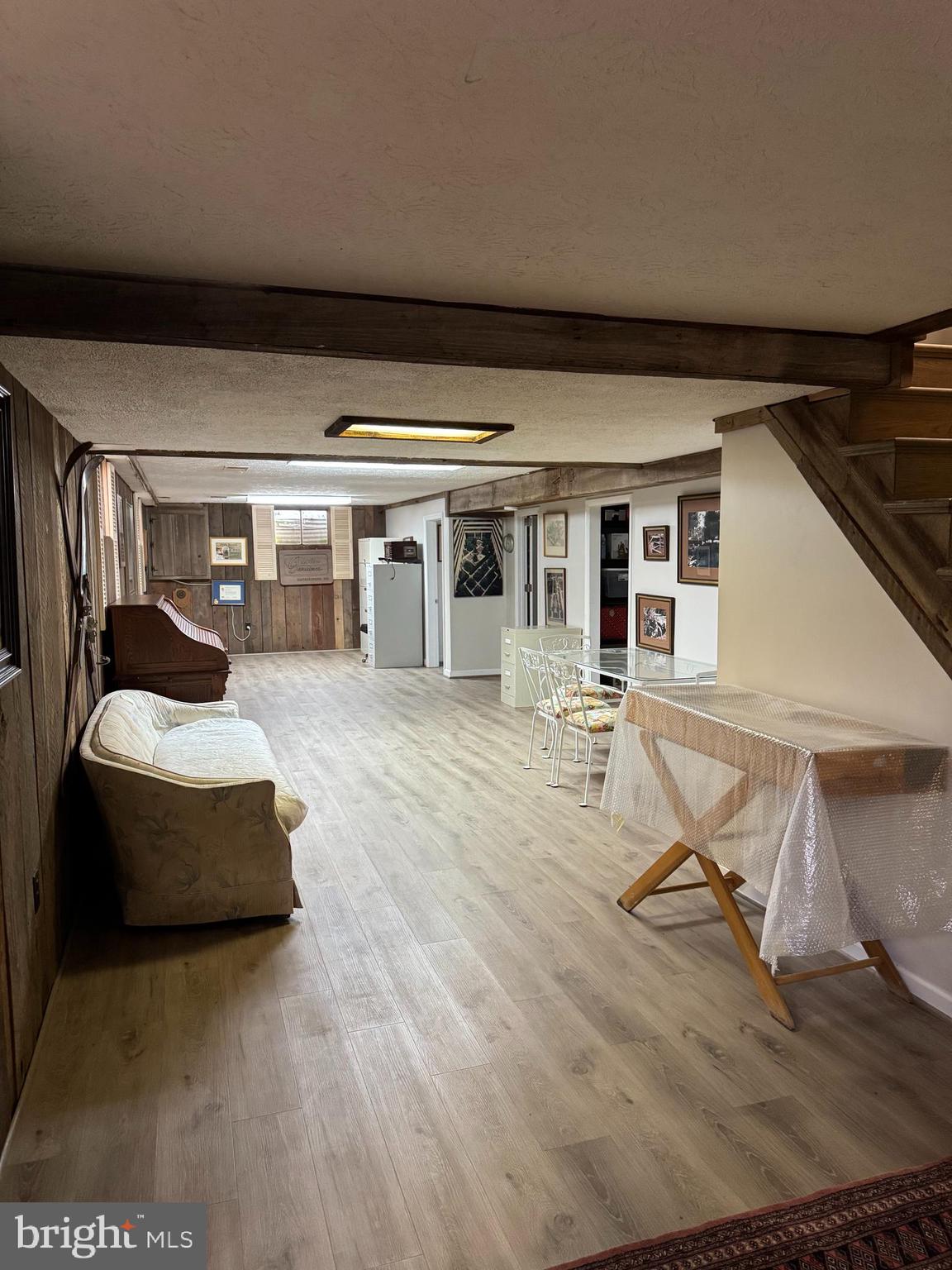 7201 Hawkins Creamery Road Gaithersburg, MD 20882 - Photo 15 of 19 a living room with a balcony furniture and white walls