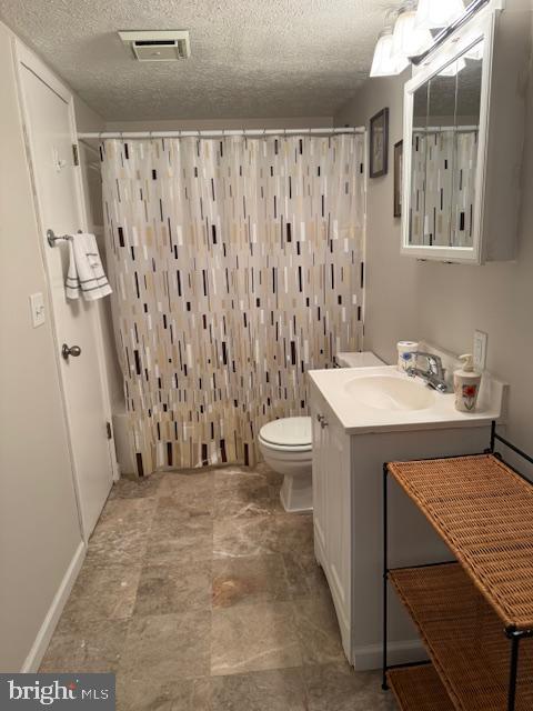 7201 Hawkins Creamery Road Gaithersburg, MD 20882 - Photo 16 of 19 a bathroom with a sink a toilet and shower curtain