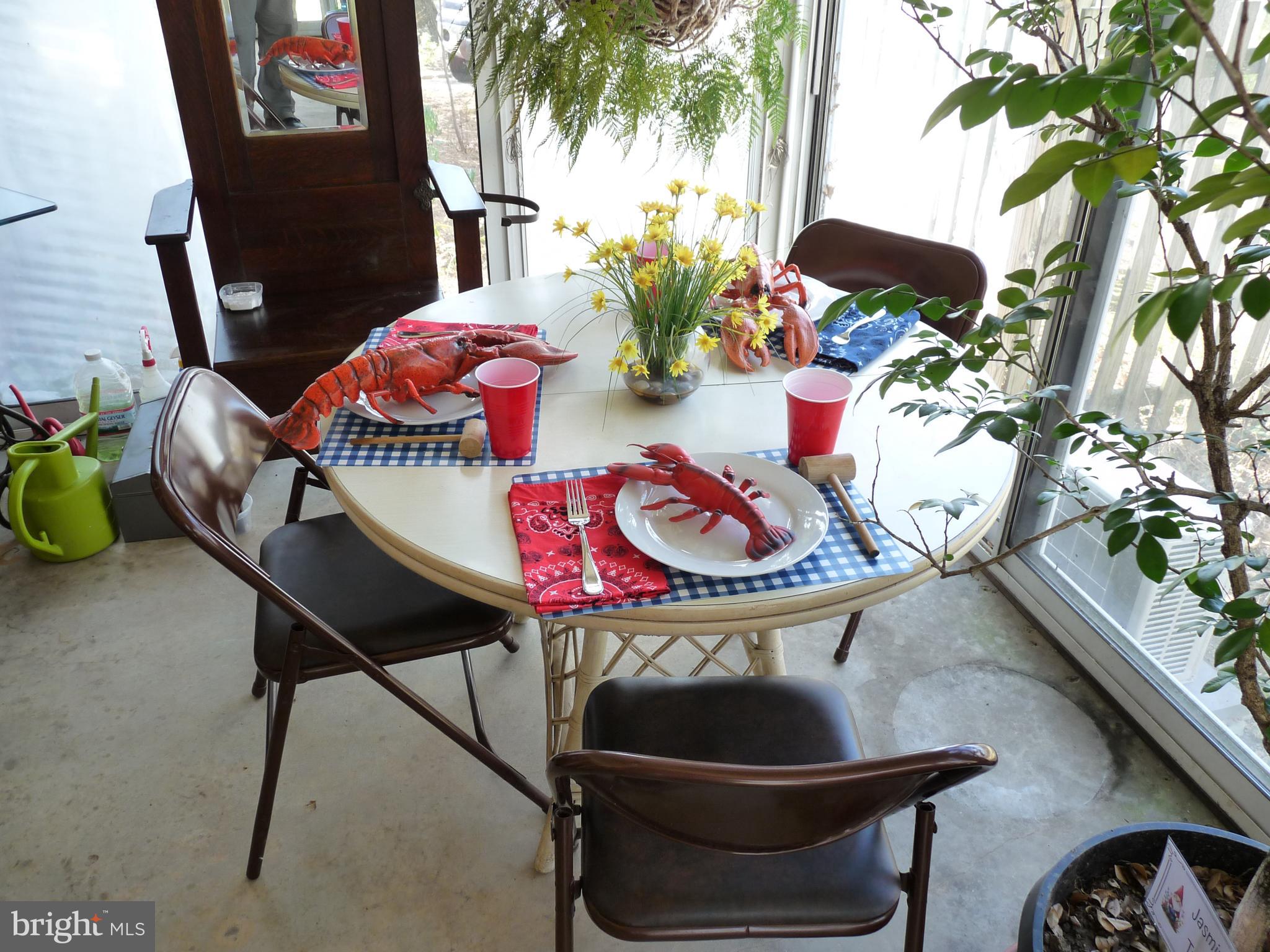 7201 Hawkins Creamery Road Gaithersburg, MD 20882 - Photo 17 of 19 a dining room with furniture and wooden floor
