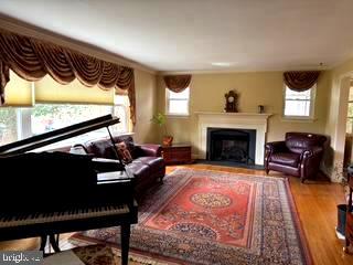 7201 Hawkins Creamery Road Gaithersburg, MD 20882 - Photo 4 of 19 a living room with furniture and a fireplace