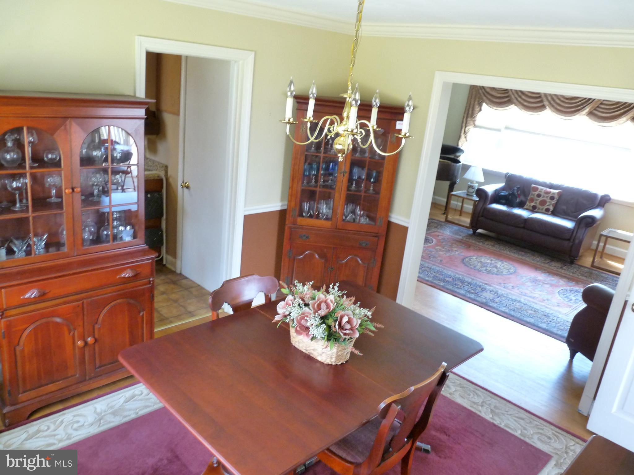 7201 Hawkins Creamery Road Gaithersburg, MD 20882 - Photo 6 of 19 a view of a dining room with furniture window and wooden floor