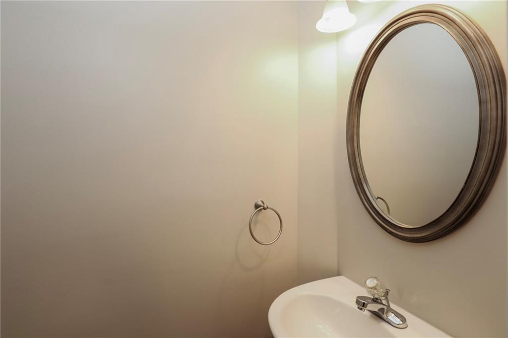 346 Beynon Terrace Suwanee, GA 30024 - Photo 15 of 17 a bathroom with a sink and a mirror