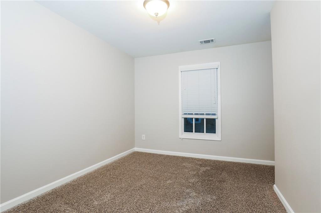 346 Beynon Terrace Suwanee, GA 30024 - Photo 10 of 17 an empty room with a window