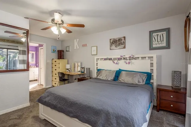 a utility room with a sink dishwasher a washer and dryer with mirror