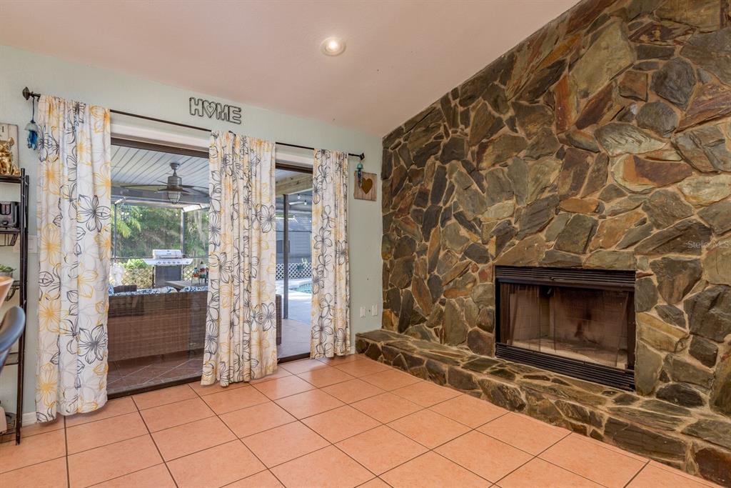 7487 Alhambra Court Spring Hill, FL 34606 - Photo 24 of 61 a room with fireplace