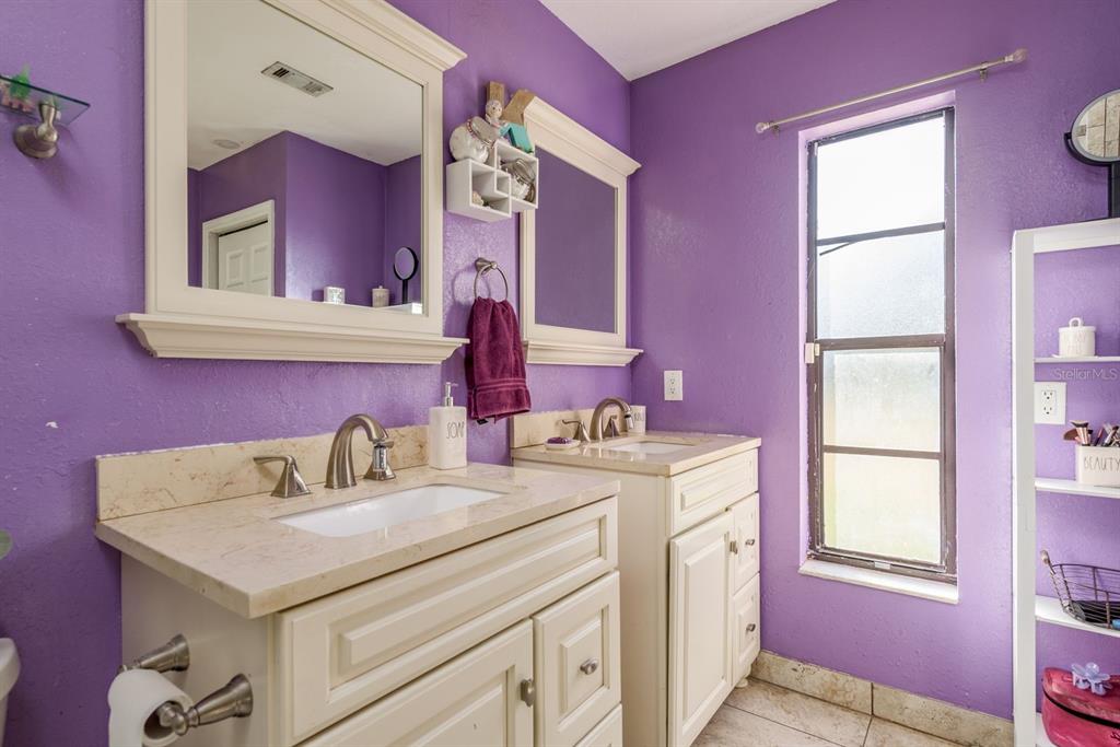 7487 Alhambra Court Spring Hill, FL 34606 - Photo 27 of 58 a utility room with a sink dishwasher a washer and dryer with mirror