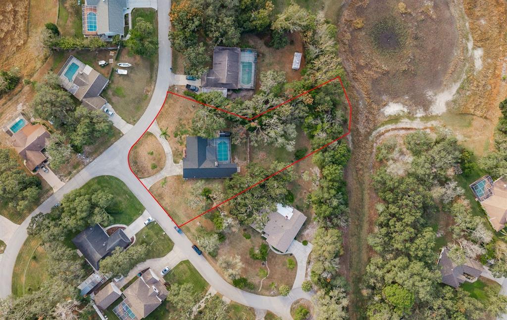 7487 Alhambra Court Spring Hill, FL 34606 - Photo 3 of 58 an aerial view of a house with outdoor space