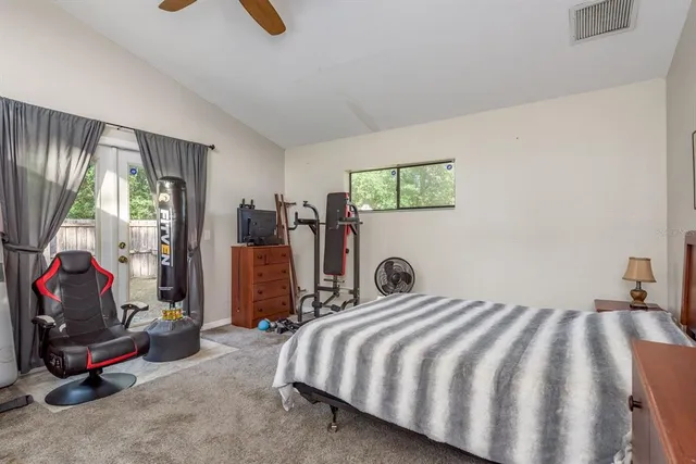 a living room with furniture and large window