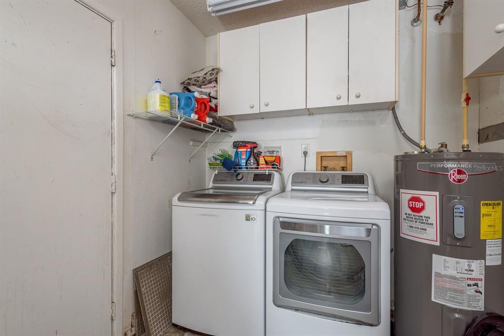 7487 Alhambra Court Spring Hill, FL 34606 - Photo 36 of 58 a utility room with dryer and washer