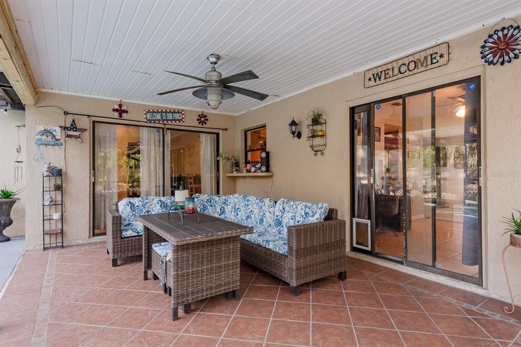 7487 Alhambra Court Spring Hill, FL 34606 - Photo 38 of 58 a living room with furniture and large window