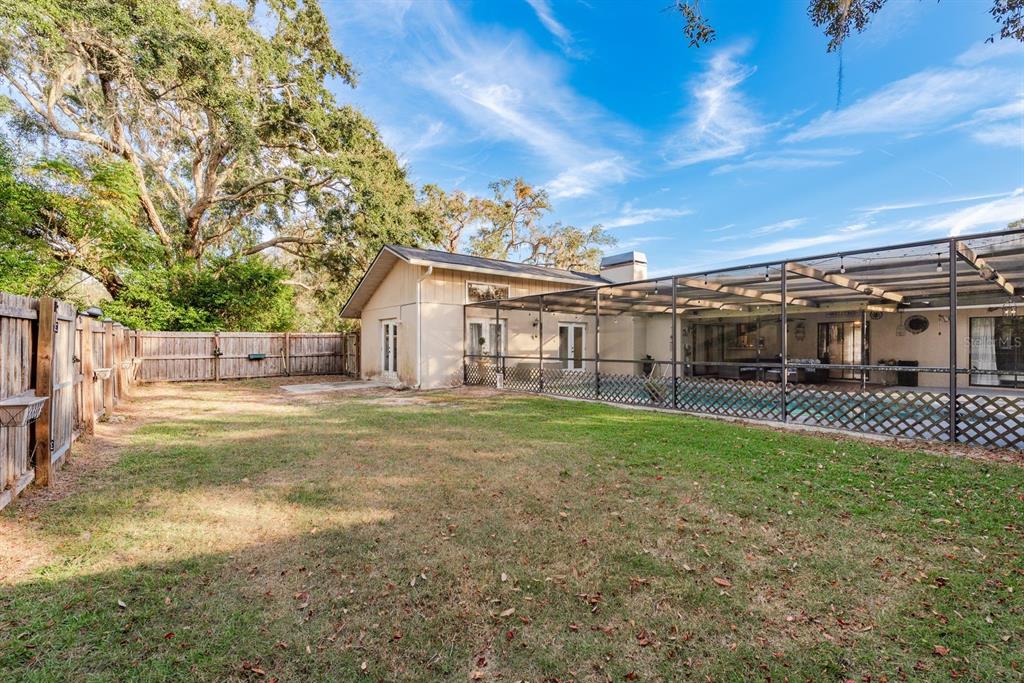 7487 Alhambra Court Spring Hill, FL 34606 - Photo 46 of 58 a view of a house with backyard and sitting area