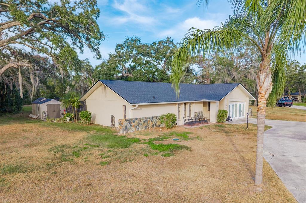 7487 Alhambra Court Spring Hill, FL 34606 - Photo 52 of 58 front view of a house with a big yard
