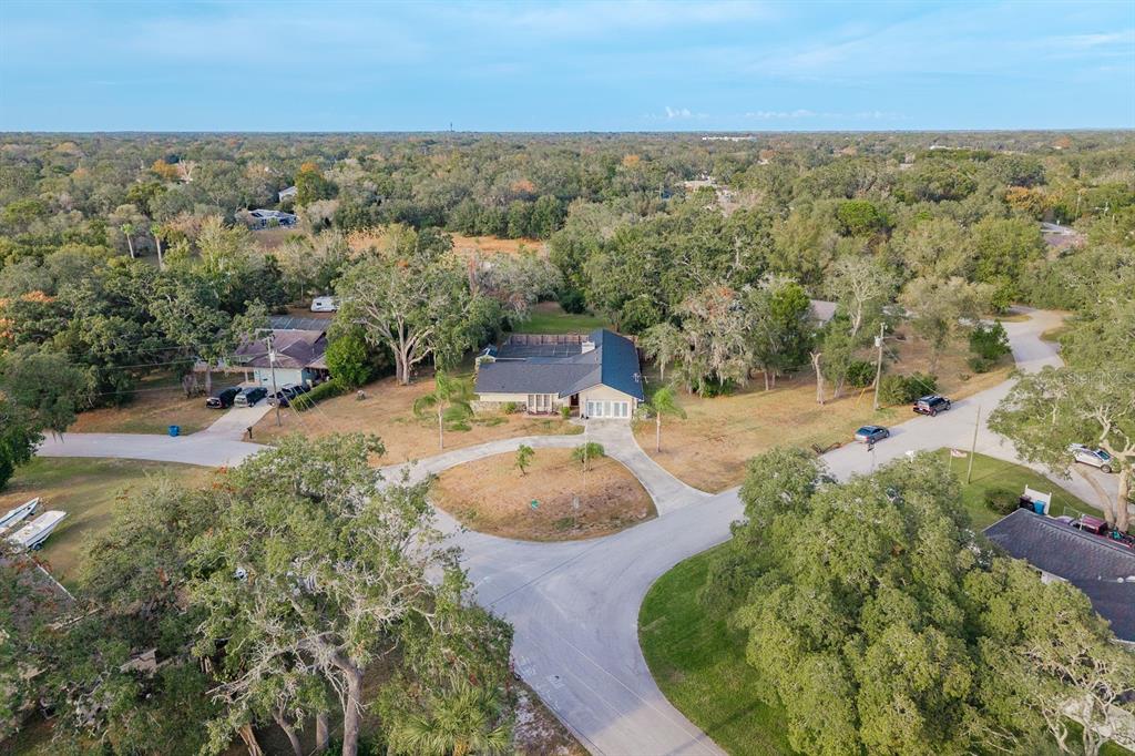 7487 Alhambra Court Spring Hill, FL 34606 - Photo 53 of 58 an aerial view of residential houses with outdoor space