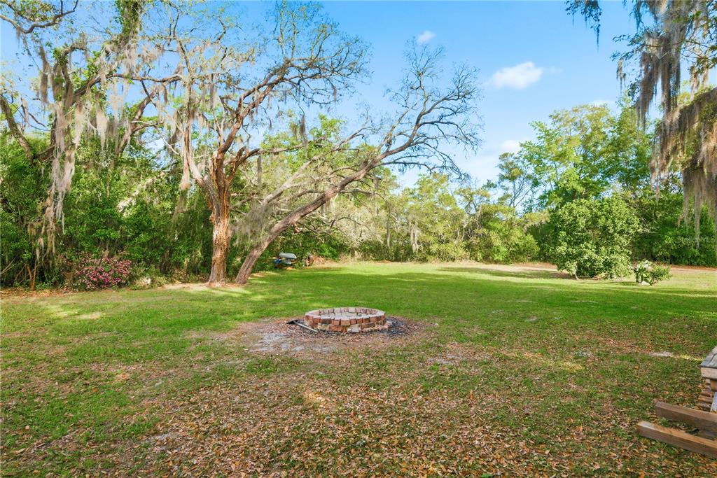 7487 Alhambra Court Spring Hill, FL 34606 - Photo 56 of 61 a view of a golf course with a tree