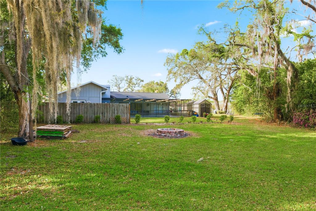 7487 Alhambra Court Spring Hill, FL 34606 - Photo 57 of 61 a view of a tiny house with backyard