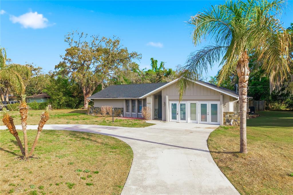 7487 Alhambra Court Spring Hill, FL 34606 - Photo 59 of 61 a view of a house with a swimming pool
