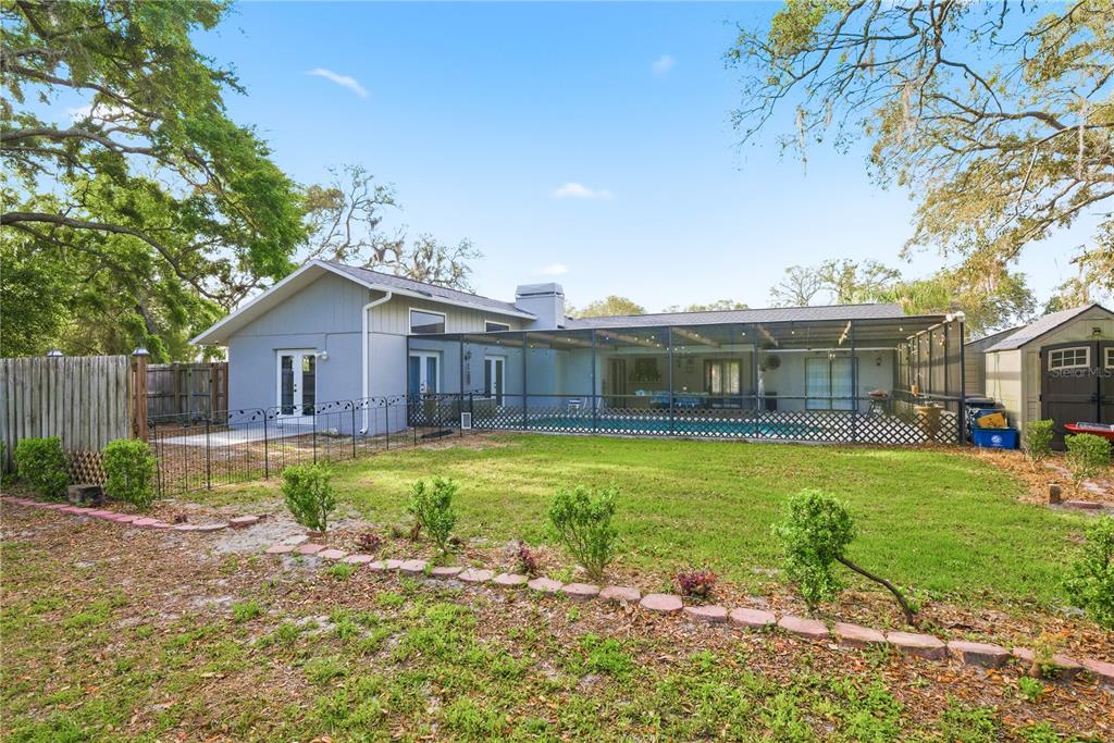 7487 Alhambra Court Spring Hill, FL 34606 - Photo 6 of 61 a front view of a house with garden