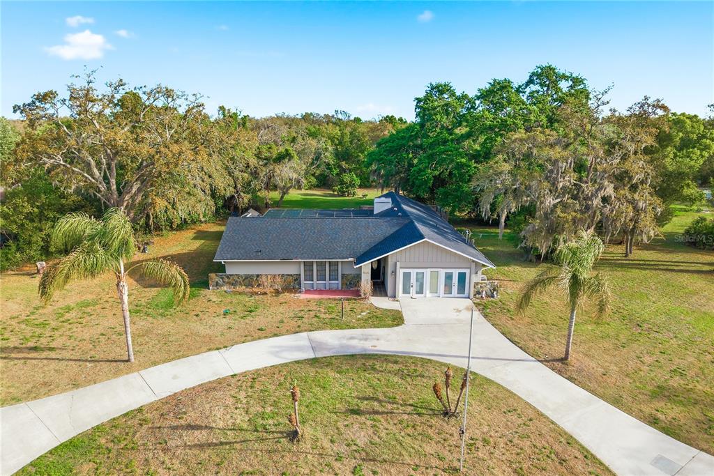 7487 Alhambra Court Spring Hill, FL 34606 - Photo 61 of 61 a swimming pool with trees in the background