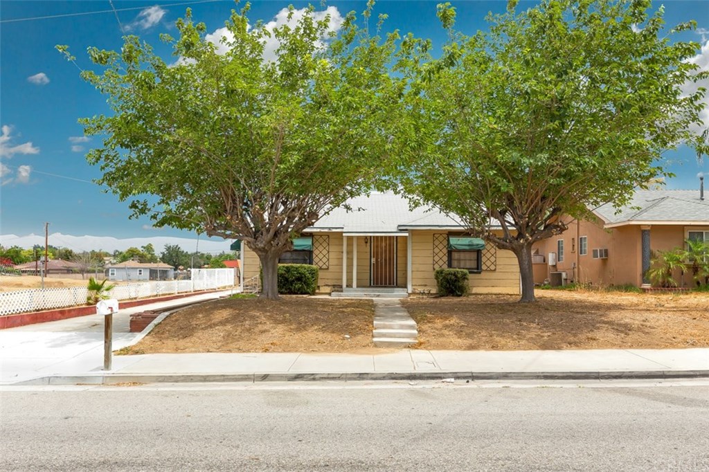 3695 Strong Street Riverside, CA 92501 - Photo 1 of 1 a front view of a house with a yard