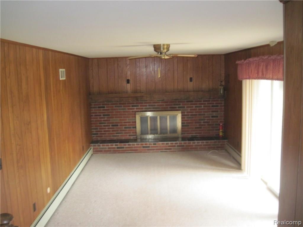 5949 Thomas Road Oxford, MI 48371 - Photo 8 of 17 Family Room with Fireplace and Doorwall