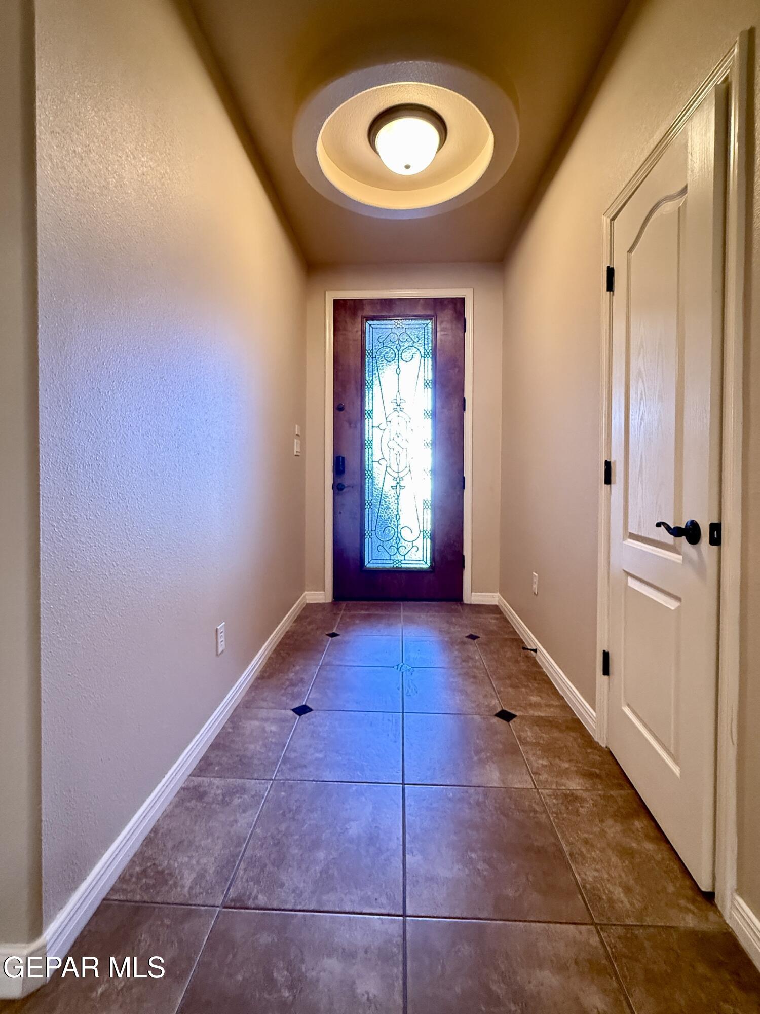 3060 Solar Point Lane El Paso, TX 79938 - Photo 11 of 49 a view of an empty room with wooden floor and window