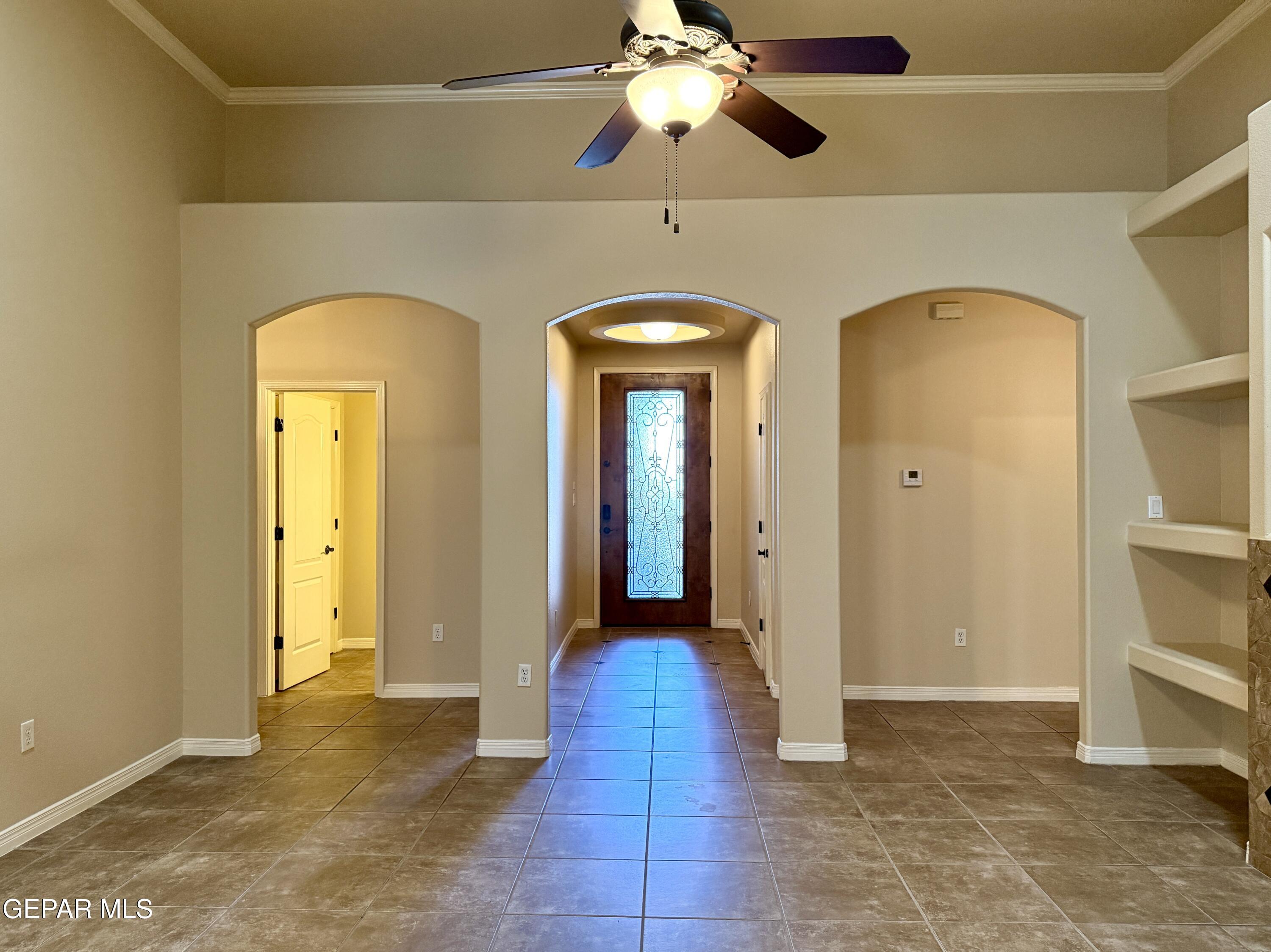 3060 Solar Point Lane El Paso, TX 79938 - Photo 12 of 49 a view of a hallway with a chandelier fan