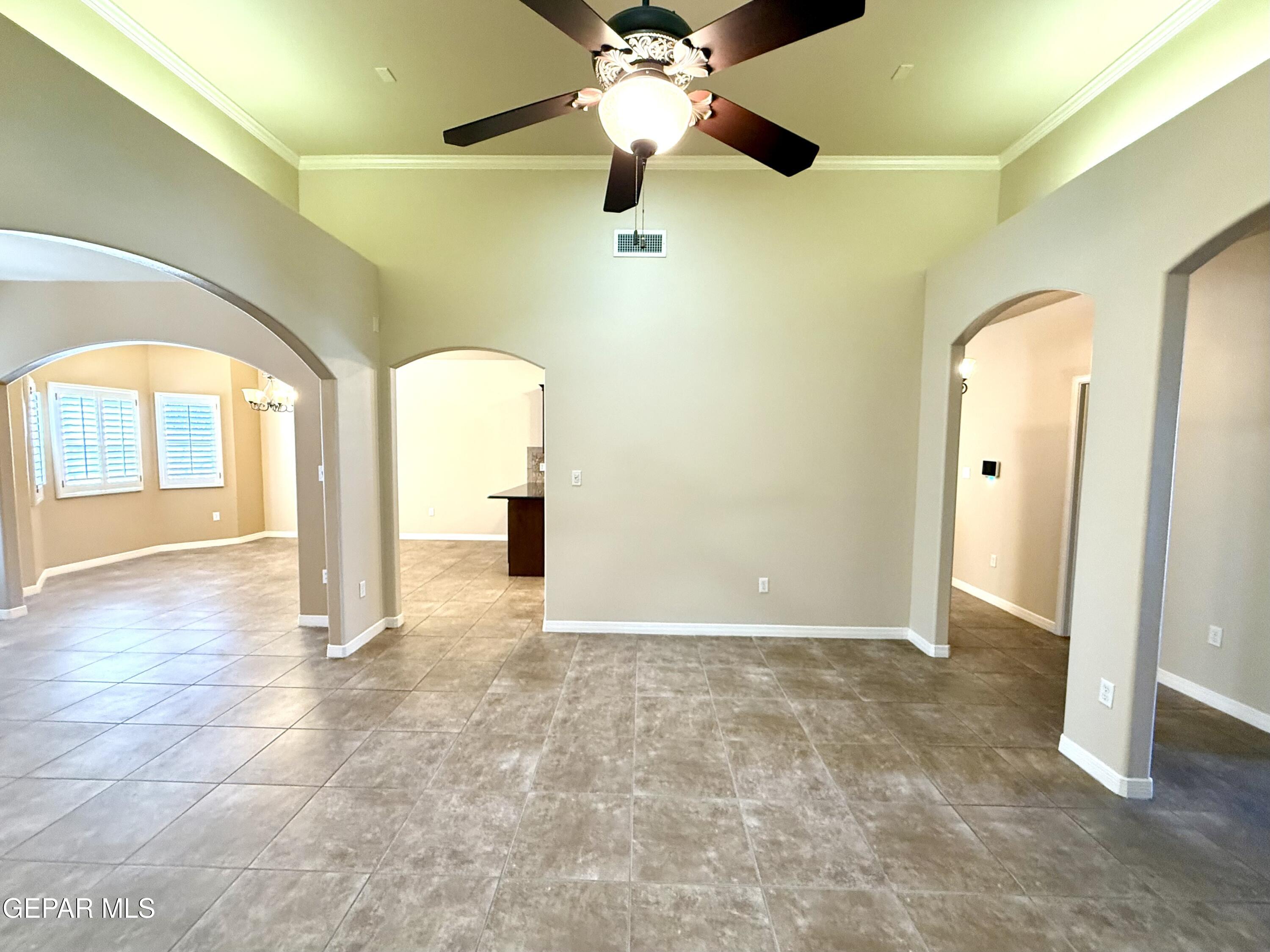 3060 Solar Point Lane El Paso, TX 79938 - Photo 16 of 49 a view of a big room with chandelier fan and windows