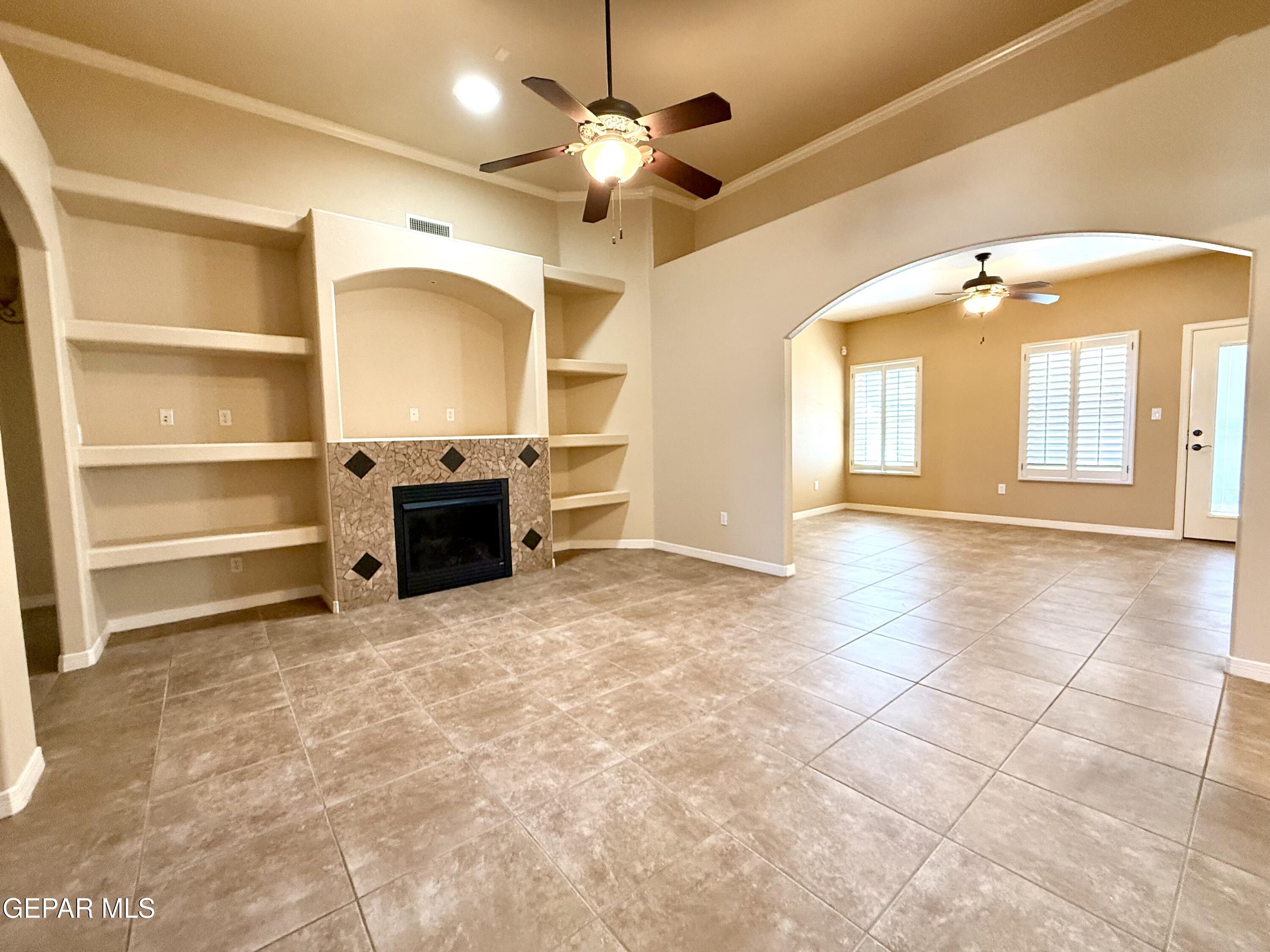 3060 Solar Point Lane El Paso, TX 79938 - Photo 2 of 49 a view of a livingroom with a stove and a cabinet a fireplace