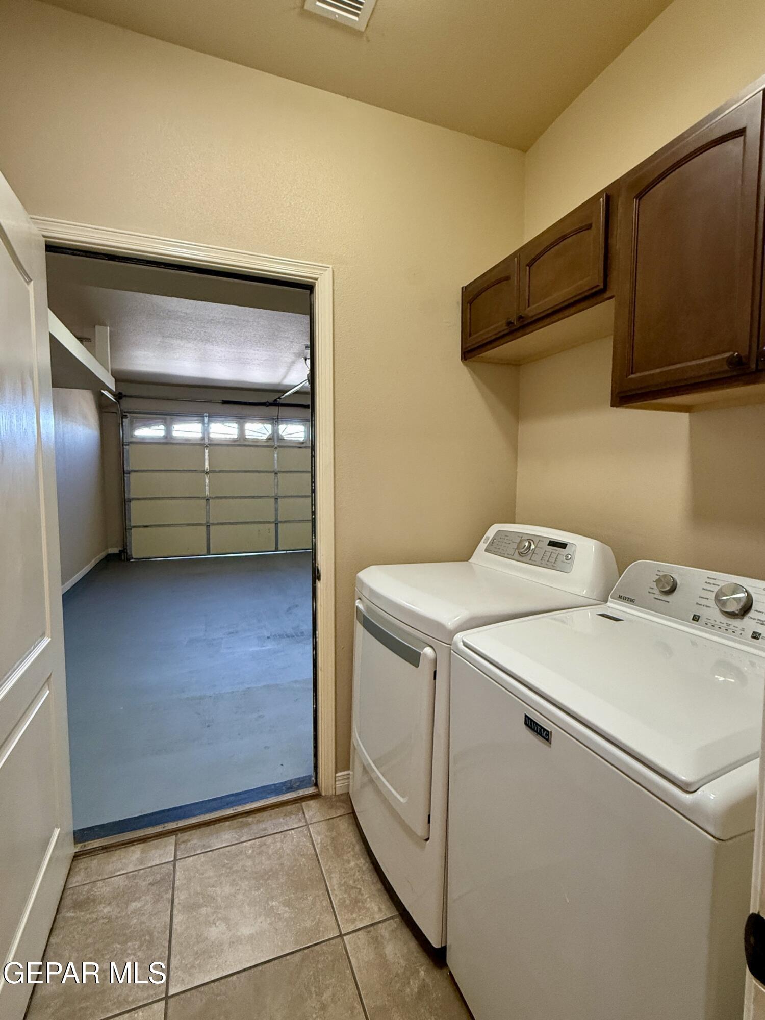 3060 Solar Point Lane El Paso, TX 79938 - Photo 25 of 49 a utility room with dryer and washer