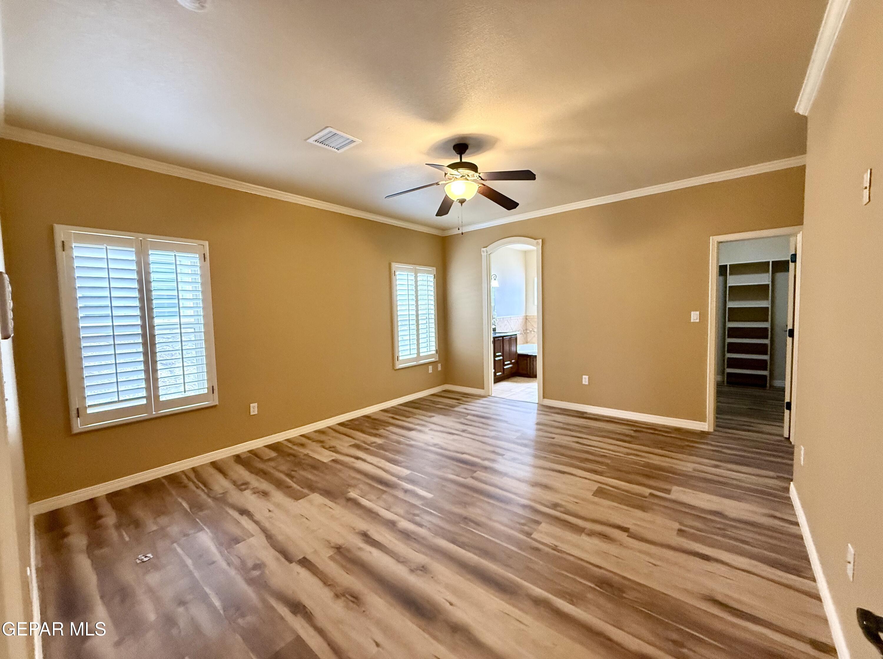3060 Solar Point Lane El Paso, TX 79938 - Photo 29 of 49 a view of an empty room with a window and a chandelier fan