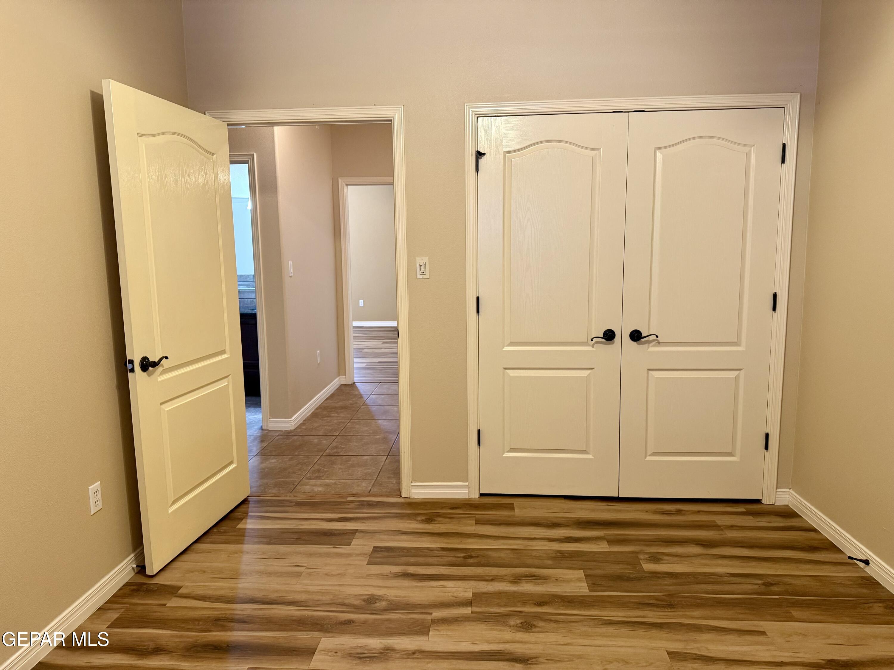 3060 Solar Point Lane El Paso, TX 79938 - Photo 39 of 49 a view of empty room with wooden floor and cabinet