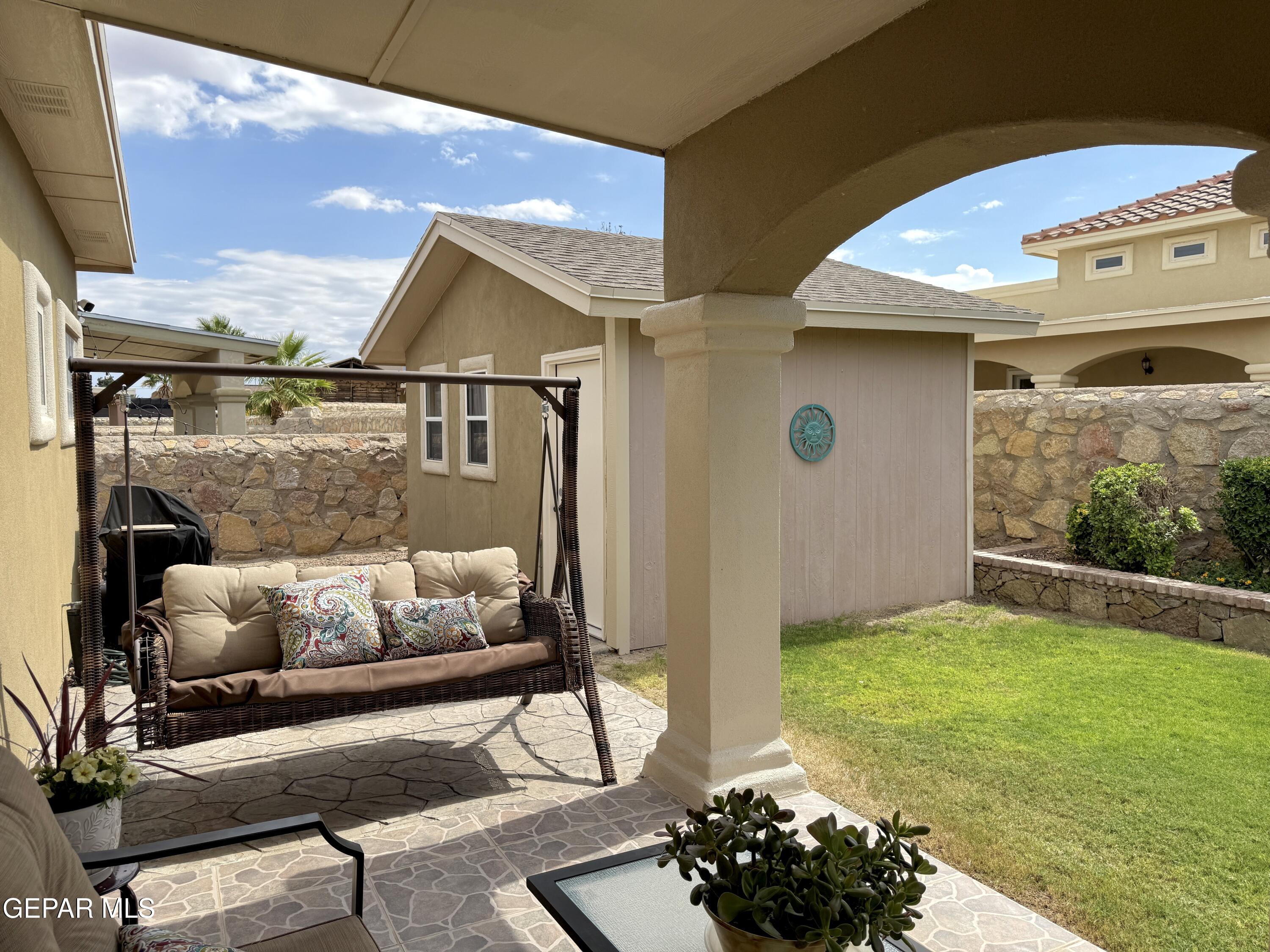 3060 Solar Point Lane El Paso, TX 79938 - Photo 47 of 49 a living room with furniture and a floor to ceiling window