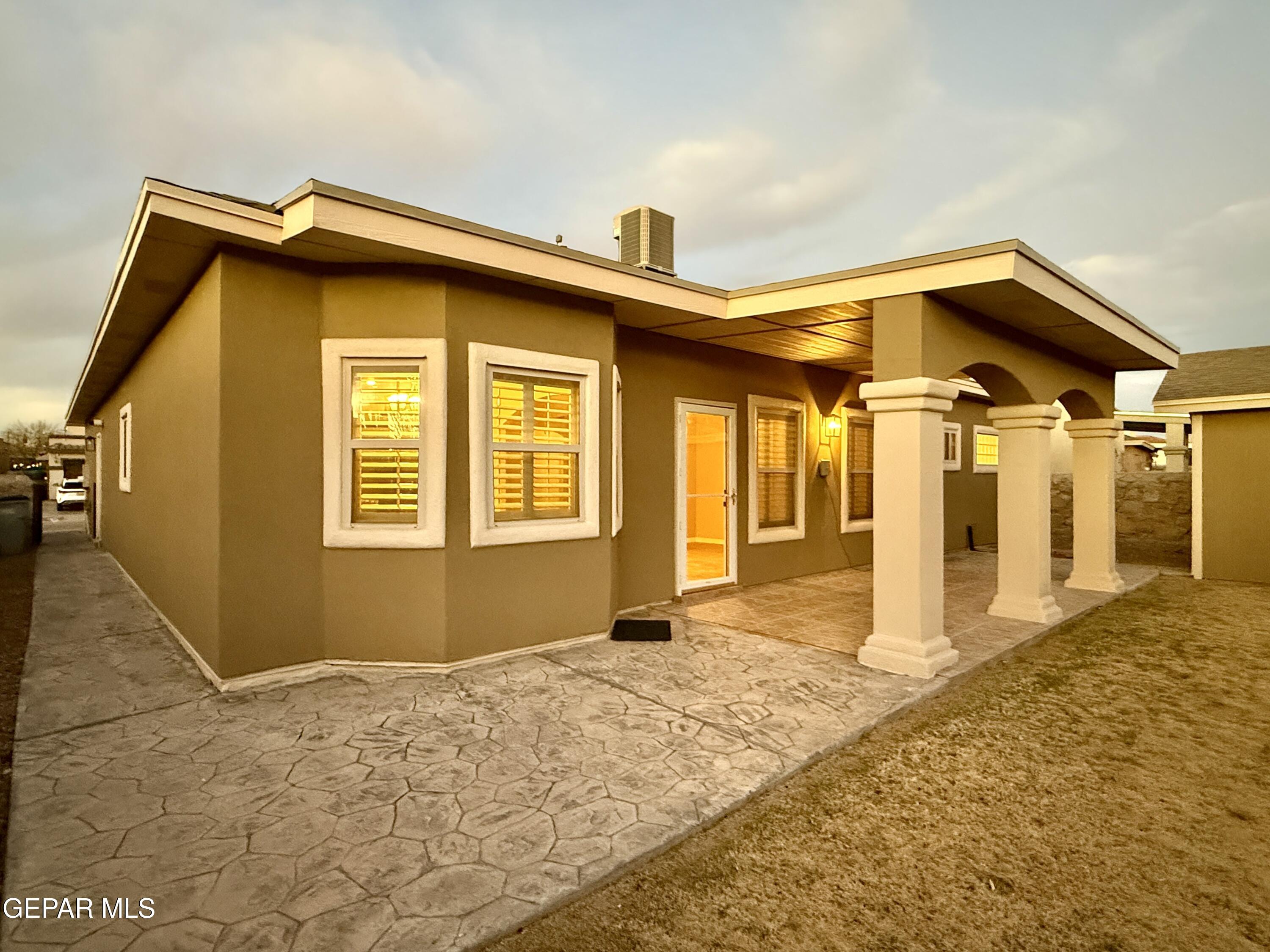 3060 Solar Point Lane El Paso, TX 79938 - Photo 6 of 49 3060- Ext Back (Night Glow)