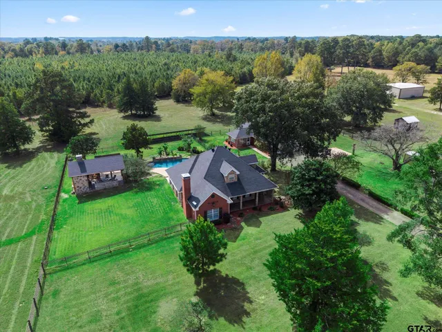 an aerial view of a house with garden