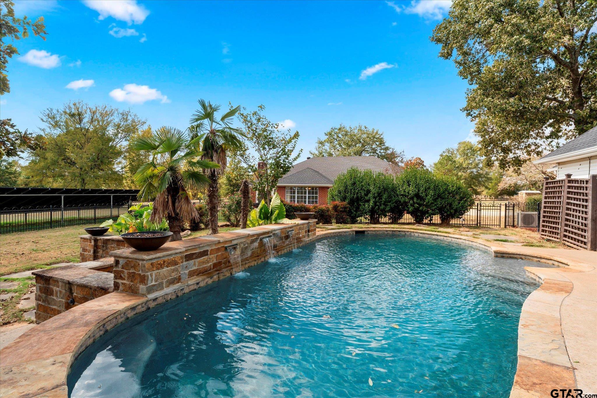 1879 Fig Road Gilmer, TX 75645 - Photo 11 of 46 a view of a house with swimming pool and sitting area
