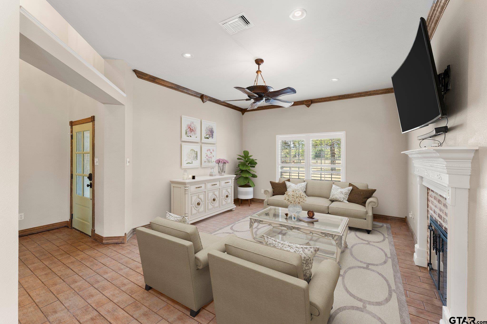 1879 Fig Road Gilmer, TX 75645 - Photo 14 of 46 a living room with furniture fireplace and flat screen tv