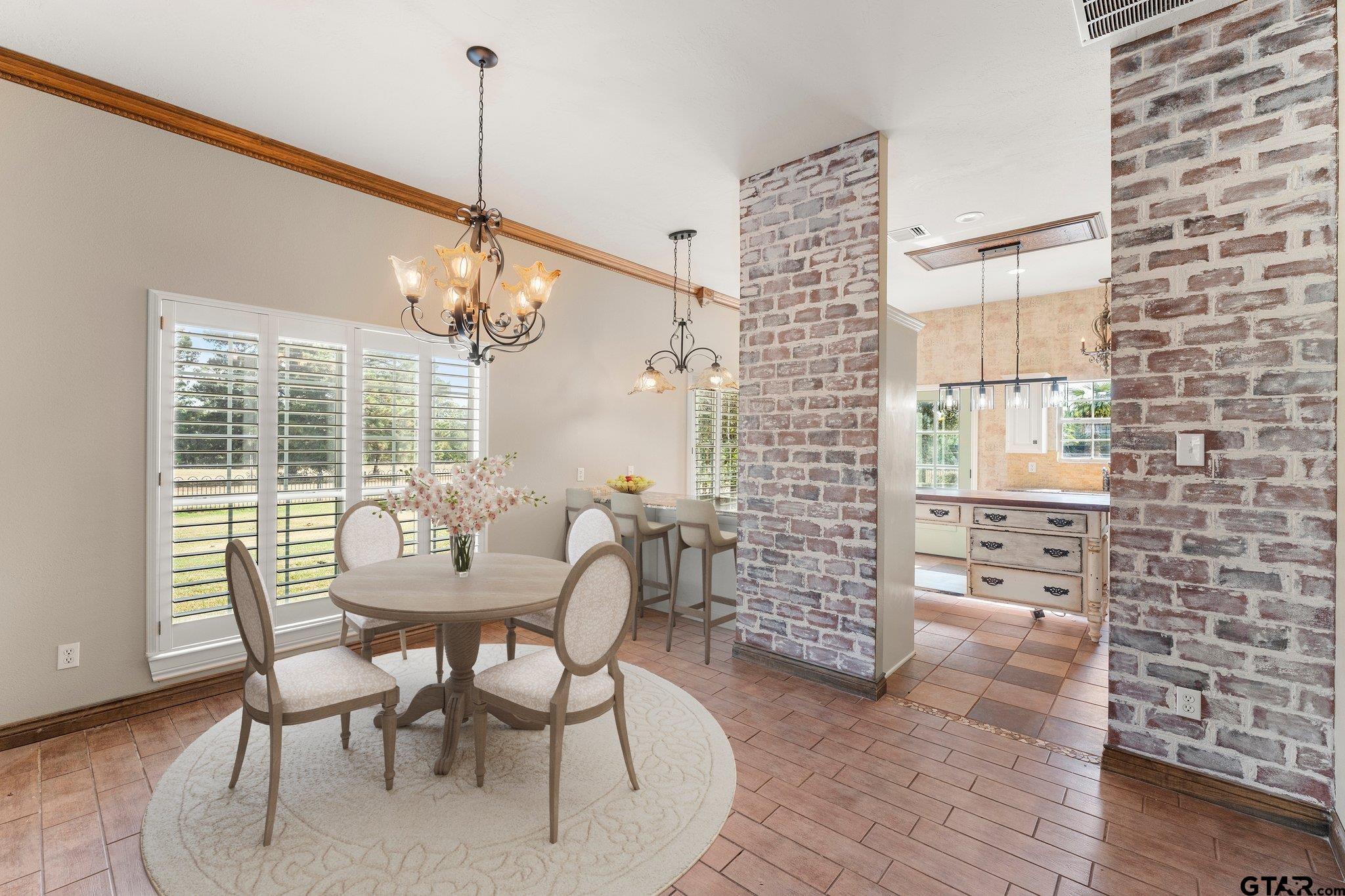 1879 Fig Road Gilmer, TX 75645 - Photo 16 of 46 a dining room with furniture and window