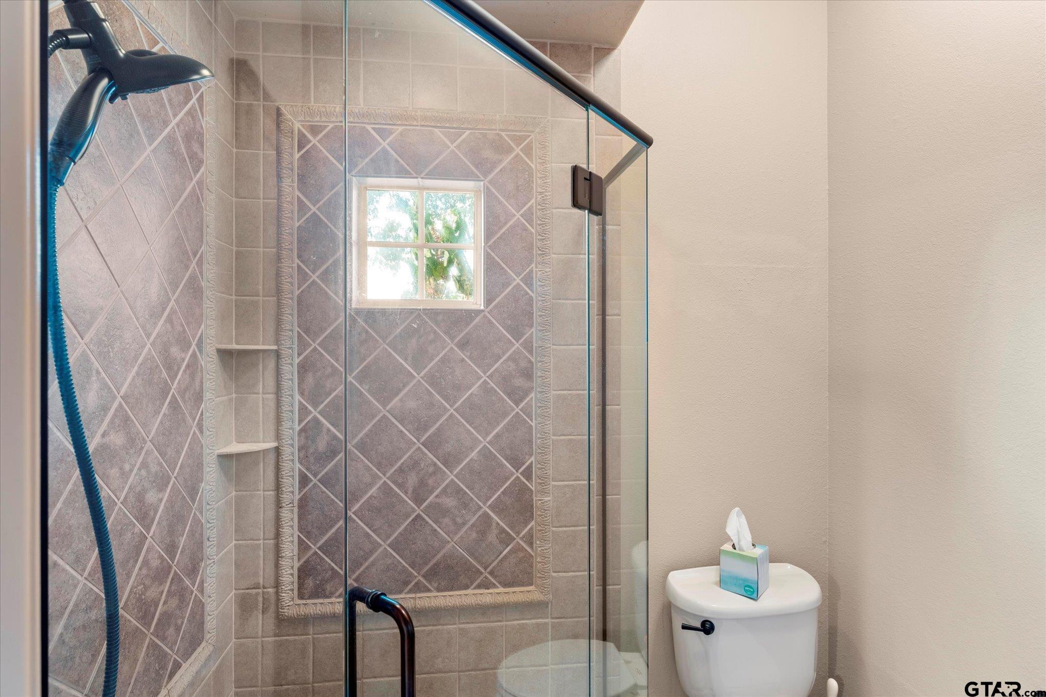 1879 Fig Road Gilmer, TX 75645 - Photo 23 of 46 a bathroom with a shower and a toilet