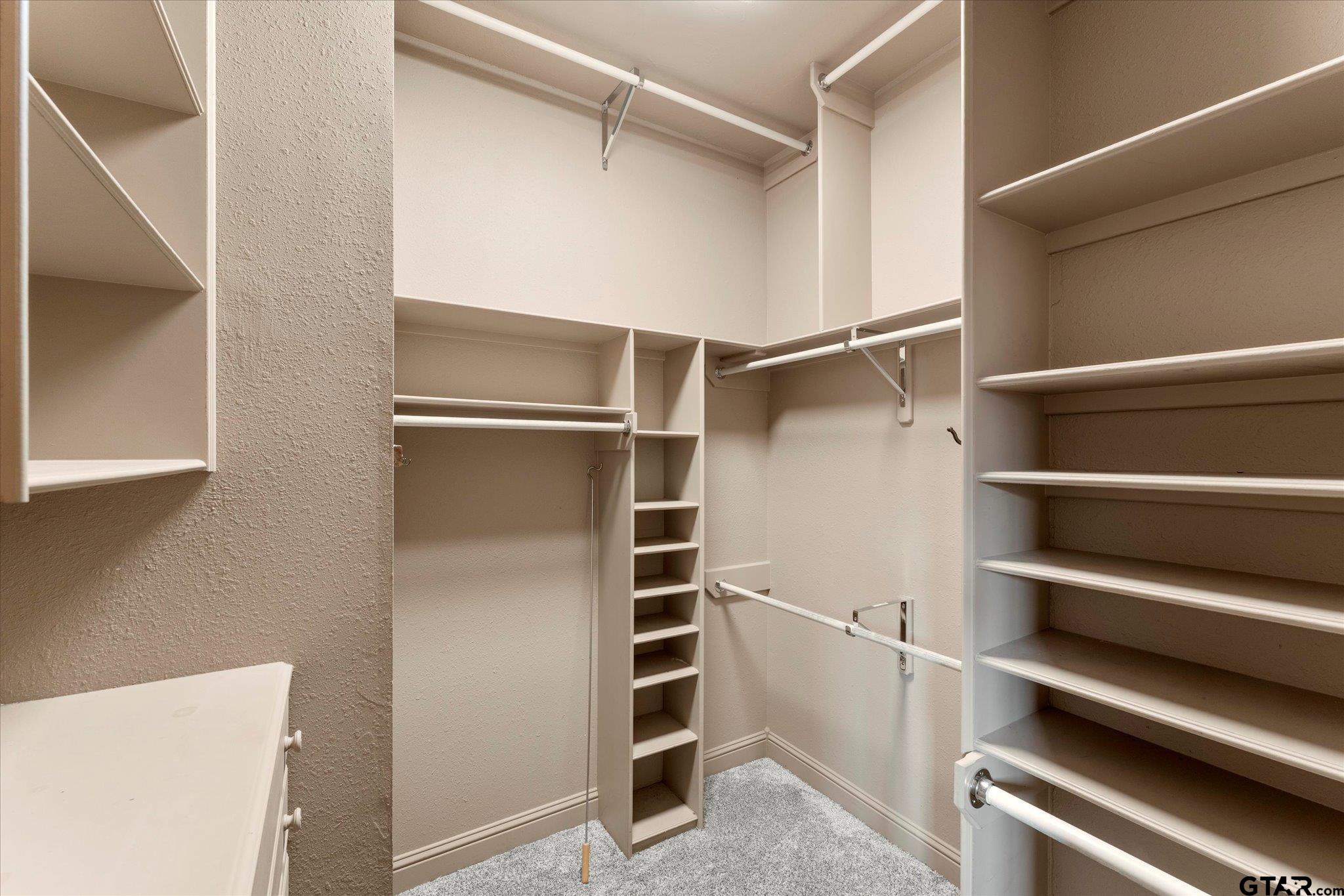 1879 Fig Road Gilmer, TX 75645 - Photo 24 of 46 a view of walk in closet with empty racks