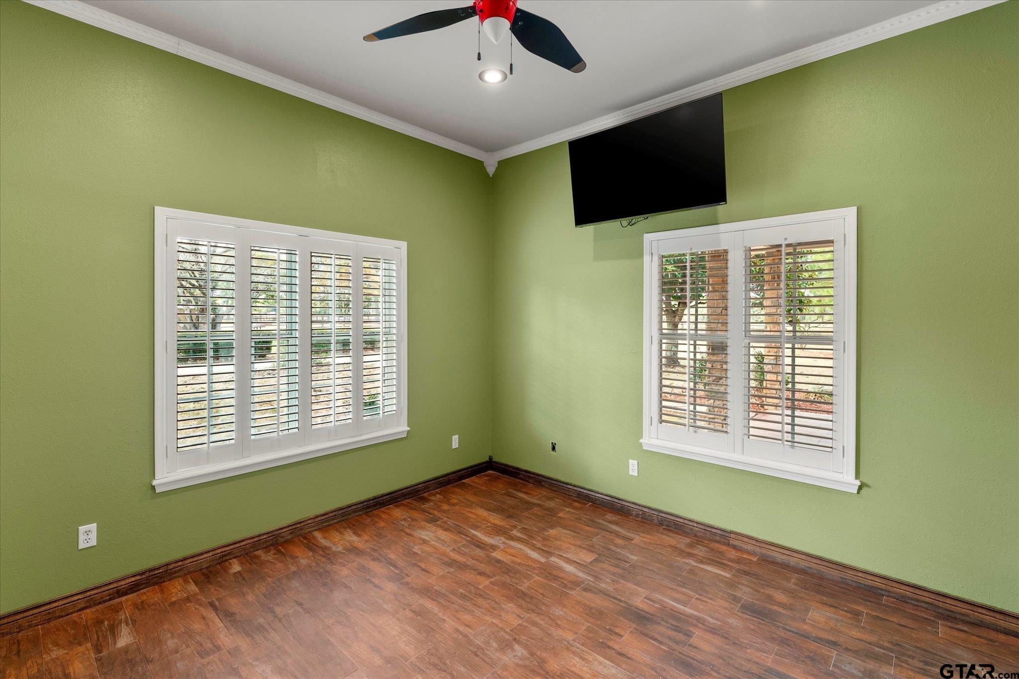 1879 Fig Road Gilmer, TX 75645 - Photo 27 of 46 a view of an empty room with wooden floor and a window