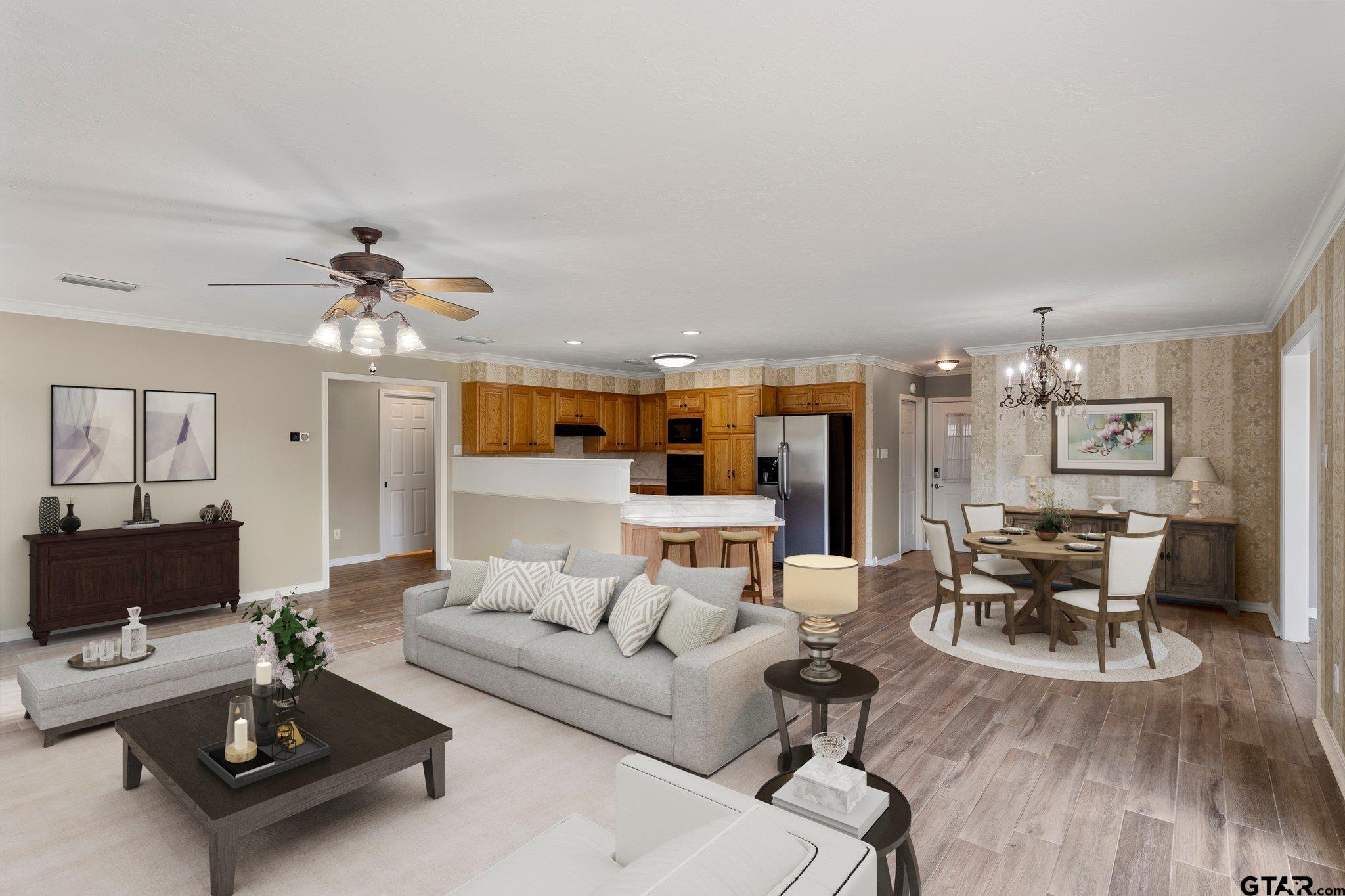 1879 Fig Road Gilmer, TX 75645 - Photo 32 of 46 a living room with furniture a wooden floor and chandelier
