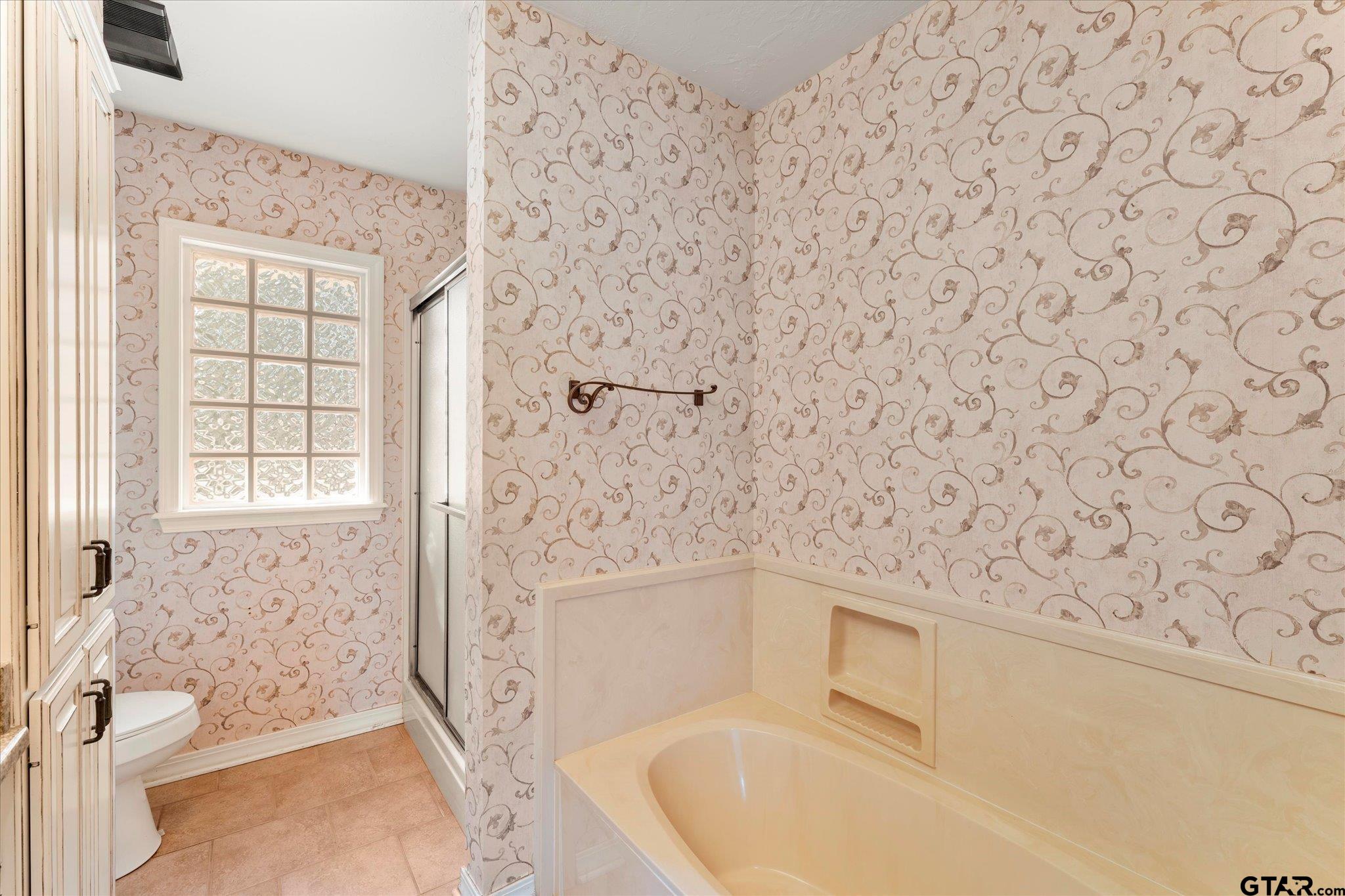 1879 Fig Road Gilmer, TX 75645 - Photo 35 of 46 a bathroom with a bathtub and shower