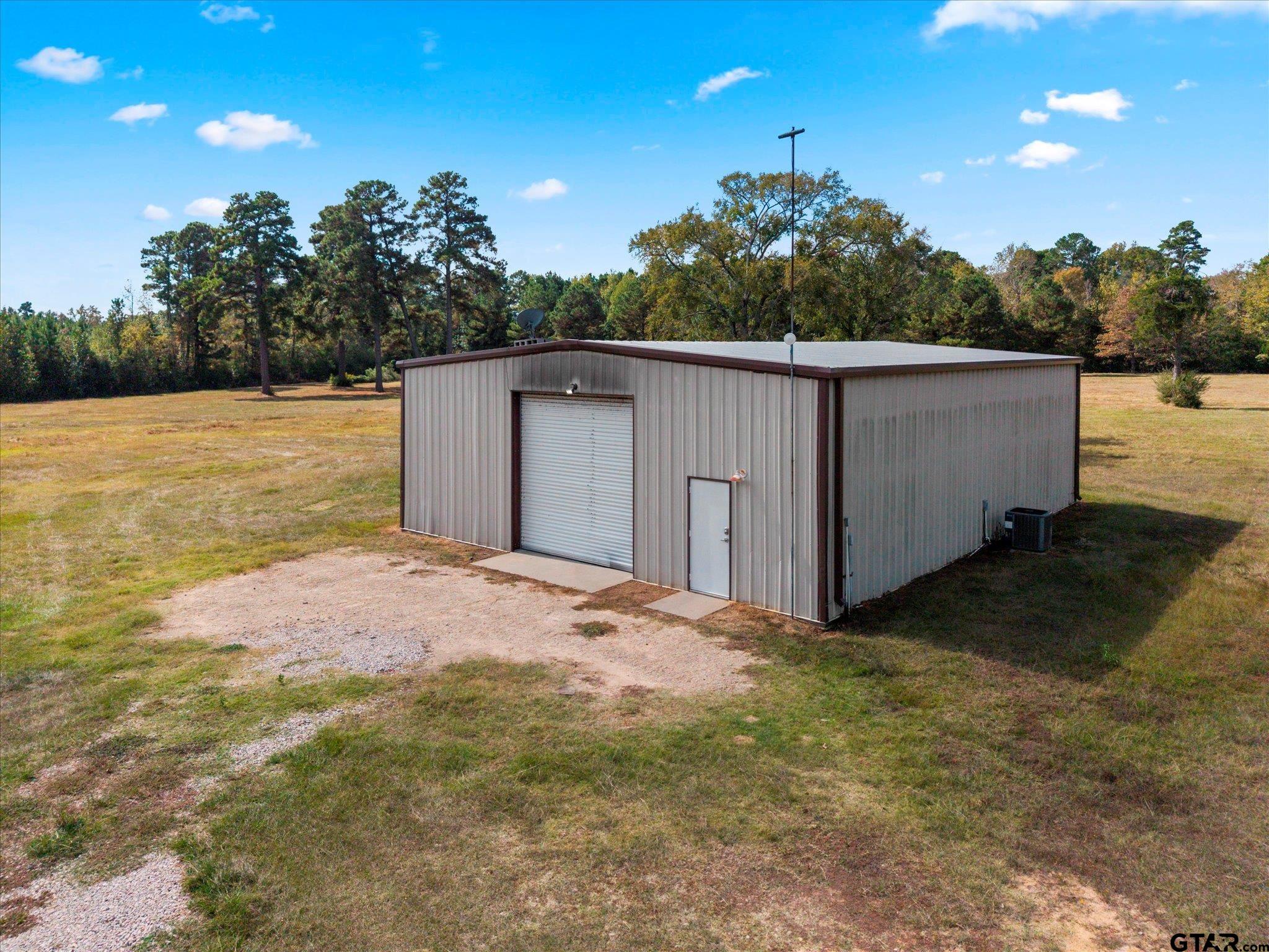 1879 Fig Road Gilmer, TX 75645 - Photo 38 of 46 a backyard of a house with lots of green space