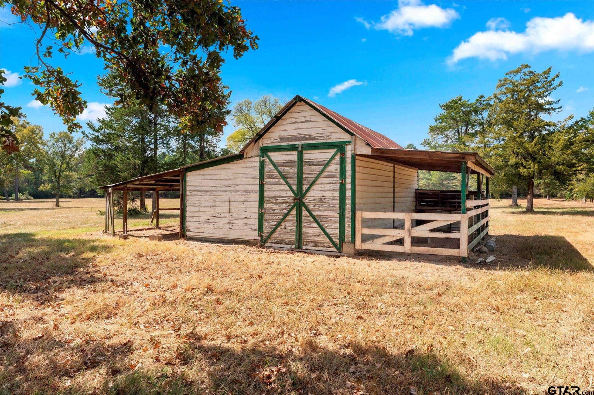 1879 Fig Road Gilmer, TX 75645 - Photo 40 of 46 a view of a house with backyard and trees