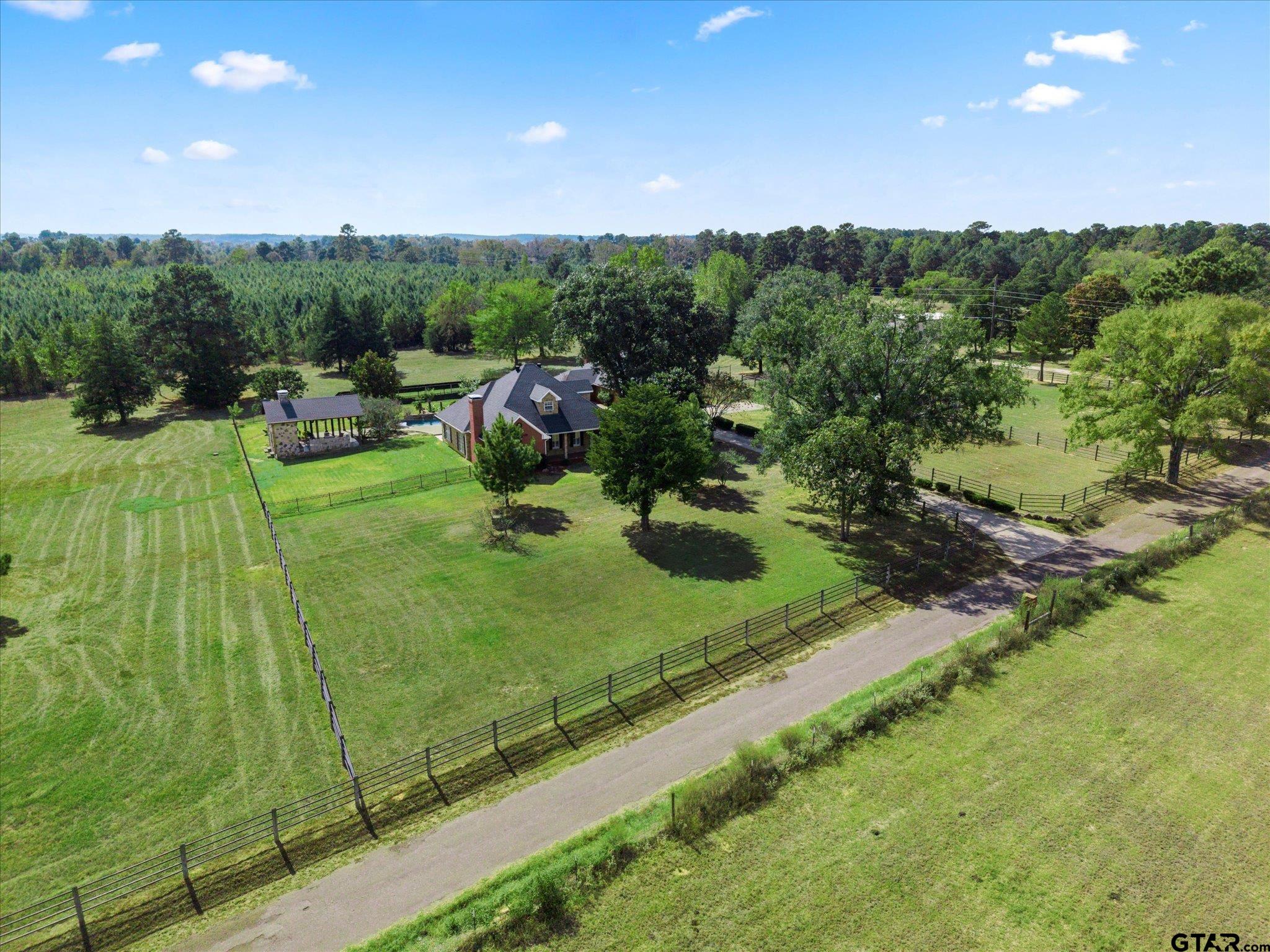 1879 Fig Road Gilmer, TX 75645 - Photo 5 of 46 a view of a garden with an outdoor space